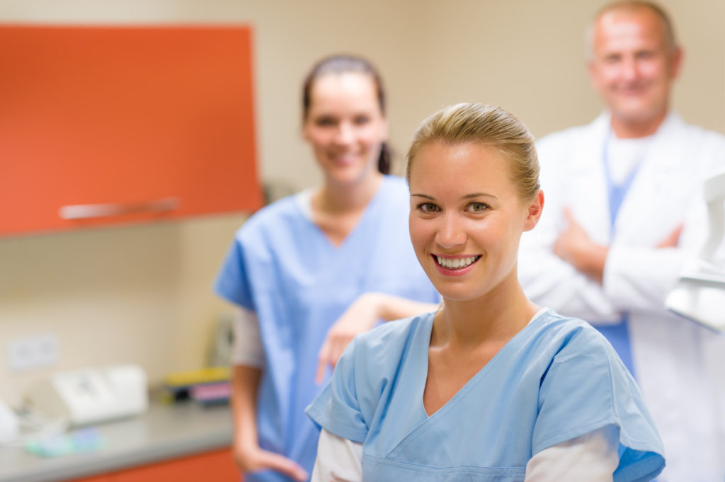 Smiling medical professional team at the surgery - New Patient Acquisition, Part III