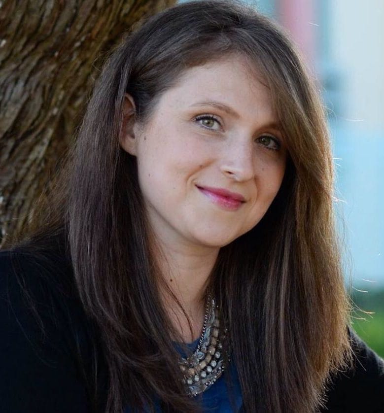 Portrait of a smiling professional woman in business attire.