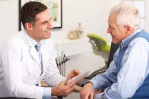 Patient discussing payment options with dental staff.
