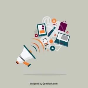 Megaphone with business equipment including charts, gears, and a laptop on a table.