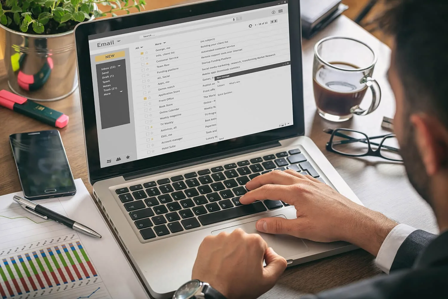 A person's hands on a computer with email app open.