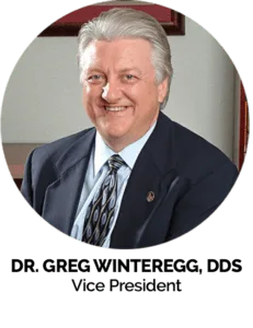 A professional portrait of Dr. Greg Winteregg.