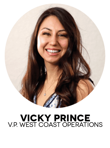 Portrait of a smiling woman in professional attire.