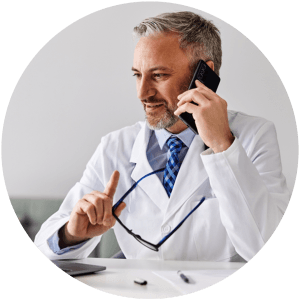 Dental hygienist coordinating patient appointments in office setting.