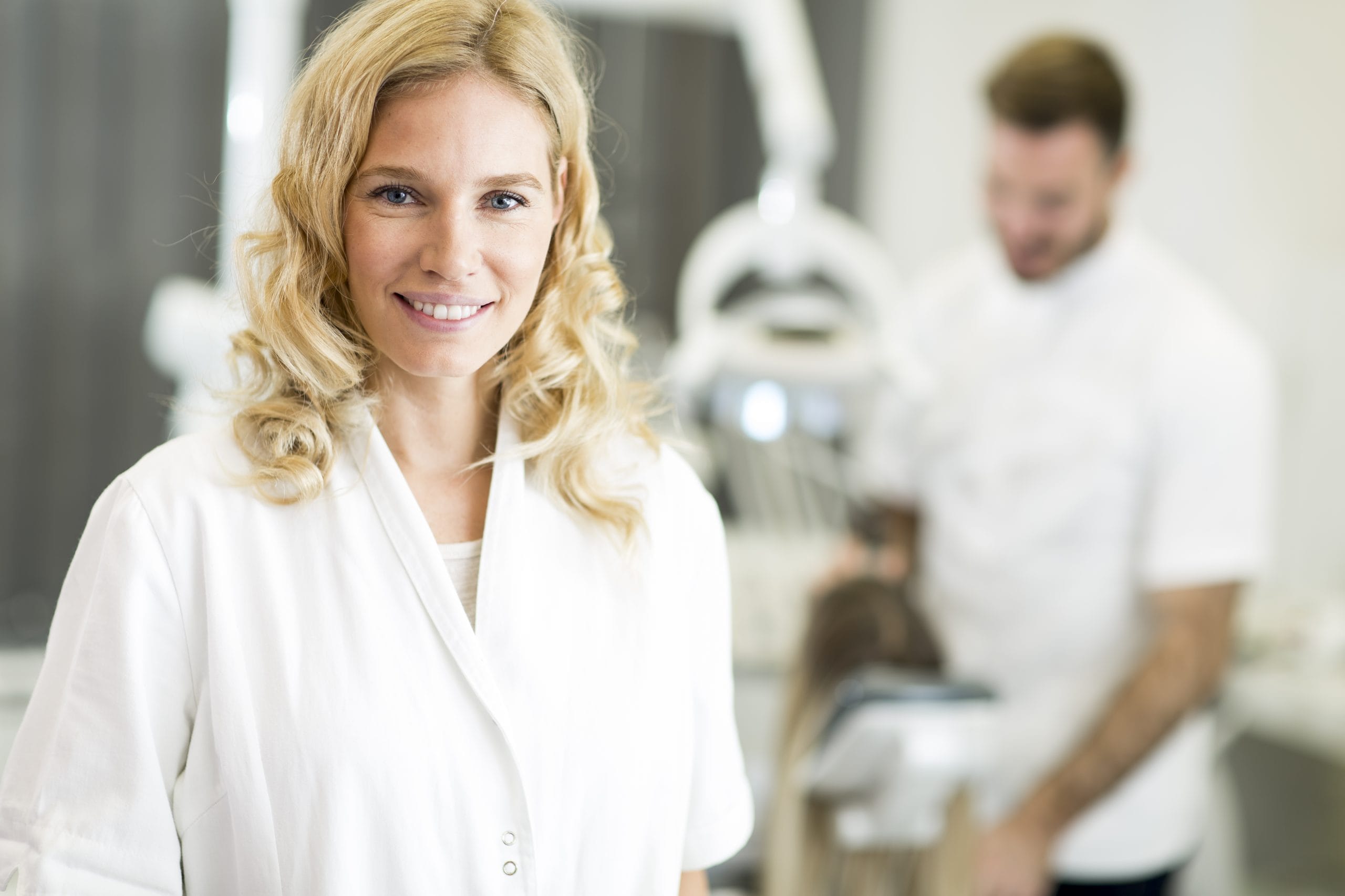 Attractive blonde female dental worker