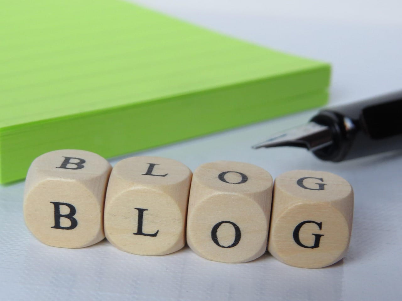 Wooden lettered blocks spelling the word ‘blog’.