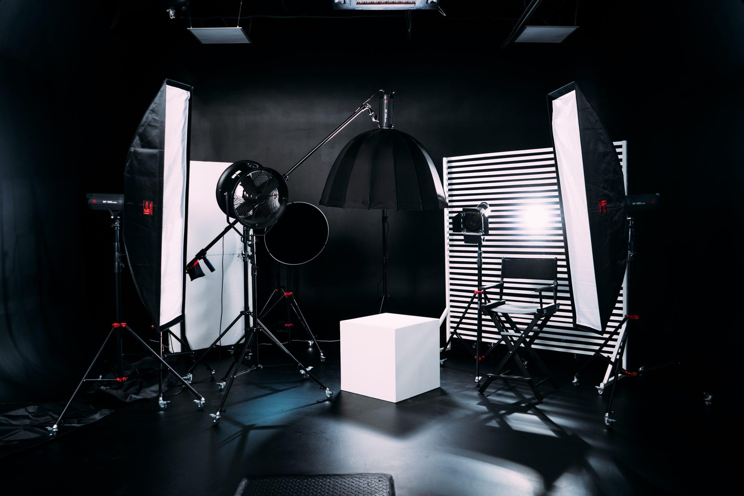 Video recording equipment including cameras, lights, and microphones.