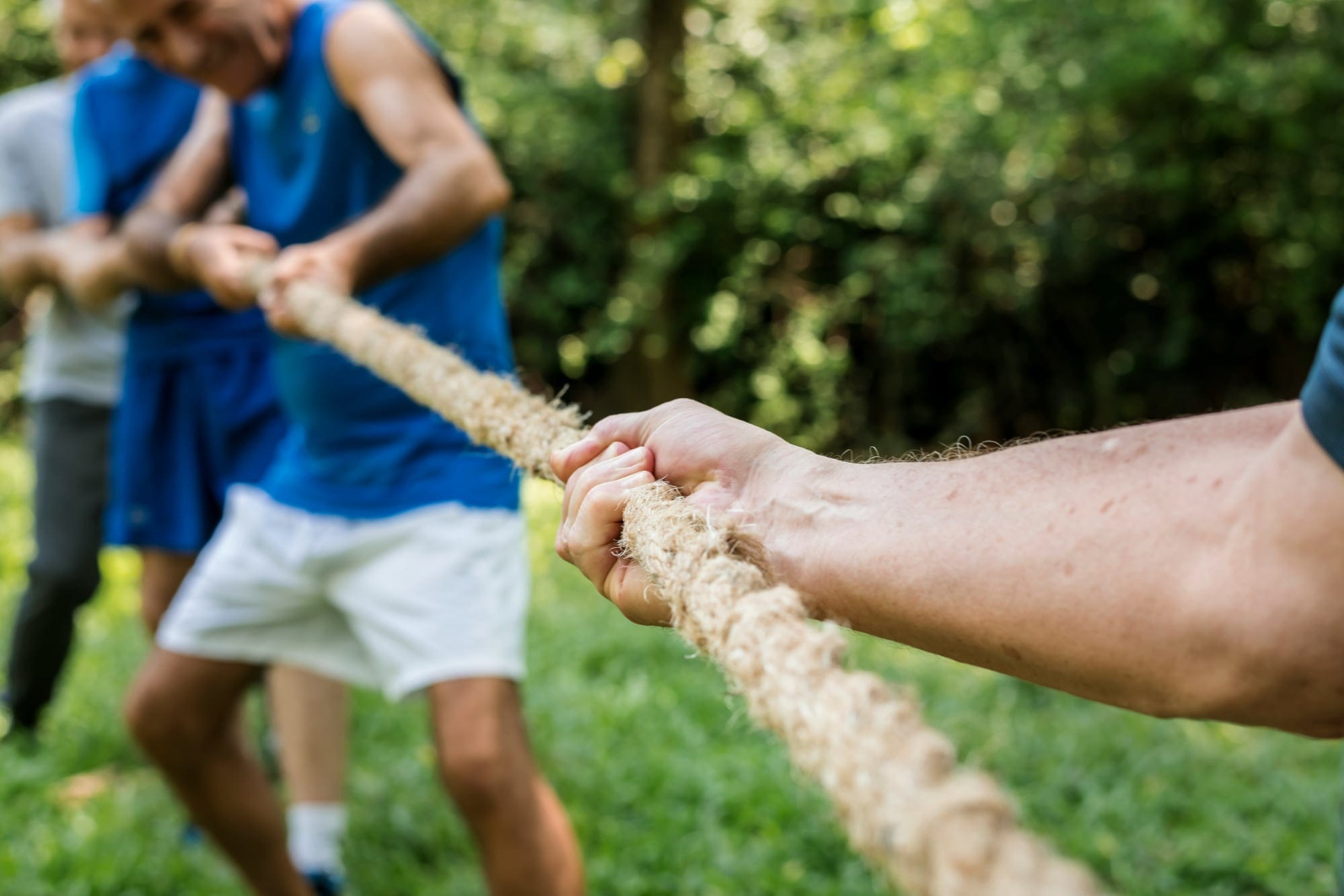 Two teams competing in a tug-of-war.